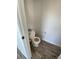 Simple bathroom with toilet and wood-look flooring at 7984 Dardanelle Valley St, Las Vegas, NV 89139