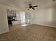 Dining room with tile floors, ceiling fan, and kitchen views at 6141 Glenborough St, Las Vegas, NV 89115