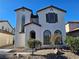 Two-story house with brown accents and landscaping at 6141 Glenborough St, Las Vegas, NV 89115