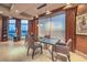 Modern dining area with glass table and striped chairs near large windows at 9101 Alta Dr # 1501, Las Vegas, NV 89145