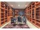 Home office with extensive built-in shelving and large desk at 9101 Alta Dr # 1501, Las Vegas, NV 89145