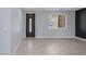 Bright entryway with wood-look flooring and decorative front door at 10028 Sharp Ridge Ave, Las Vegas, NV 89149