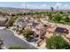 An aerial neighborhood view of solar paneled homes with a community park nearby at 10028 Sharp Ridge Ave, Las Vegas, NV 89149