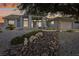 House exterior featuring a rock landscaping and a two-car garage at 639 Marina Dr, Boulder City, NV 89005