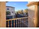 View of the community from a private balcony, showcasing townhouses and landscaping at 9528 Log Jam St, Las Vegas, NV 89178