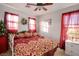 Bright bedroom with a king-size bed and a Christmas tree at 9528 Log Jam St, Las Vegas, NV 89178