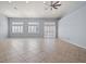 Spacious living room with tile floors and large windows at 3413 Cantura Bluff Ave, North Las Vegas, NV 89031