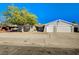 Charming single-story home with a two-car garage and landscaped front yard at 5132 Spencer St, Las Vegas, NV 89119