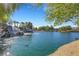 Serene lake with a waterfall and lush landscaping at 6476 Chebec St, North Las Vegas, NV 89084