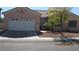 Single-story house with attached garage and neatly kept front yard at 8637 Stone Harbor Ave, Las Vegas, NV 89145