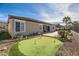 Artificial putting green and patio in backyard at 2247 Bannerwood St, Henderson, NV 89044