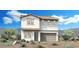 Two story home with spanish style elevation, two car garage and desert landscaping at 9051 Cielo Canyon St, Las Vegas, NV 89166