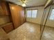 Bedroom with mirrored closet doors and ceiling fan at 3218 Ocotillo Dr, Laughlin, NV 89029