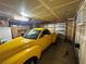 Attached garage with ample storage space and a yellow car at 3218 Ocotillo Dr, Laughlin, NV 89029