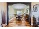 Elegant dining room with hardwood floors and a view of the living area at 2247 Bannerwood St, Henderson, NV 89044