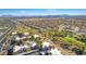 Aerial view showing community location, pool, and surrounding landscape at 1909 Rio Canyon Ct # 207, Las Vegas, NV 89128