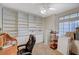 Home office with built-in shelving and large window at 8962 Shale Valley St, Las Vegas, NV 89123