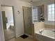 Bathroom with shower, bathtub, and updated fixtures at 3605 Perching Bird Ln, North Las Vegas, NV 89084