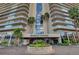 Regency Towers building exterior, featuring palm trees and a landscaped entrance at 3111 Bel Air Dr # 10H, Las Vegas, NV 89109