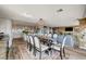 Bright dining area with a large table and chairs, adjacent to a modern kitchen at 3111 Bel Air Dr # 10H, Las Vegas, NV 89109