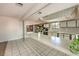 Kitchen with wood cabinets, tile floors, and stainless steel appliances at 1008 Sproul Ct, Las Vegas, NV 89145