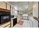 Galley kitchen with white cabinets and a tile floor at 1008 Sproul Ct, Las Vegas, NV 89145