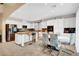 Modern kitchen with white cabinets, granite countertops and breakfast bar at 1040 Bonny Lake Ct, Henderson, NV 89015