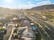 Aerial view of a house with a pool in a desert residential neighborhood at 14 Parco Fiore Ct, Henderson, NV 89011