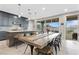 Bright dining area with a large wooden table and seating for eight, offering mountain views at 14 Parco Fiore Ct, Henderson, NV 89011