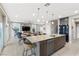 Modern kitchen with an island, stainless steel appliances, and gray cabinets at 14 Parco Fiore Ct, Henderson, NV 89011