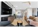 Living room with leather sofas, large TV, and stylish decor at 14 Parco Fiore Ct, Henderson, NV 89011