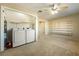 Laundry room with washer, dryer, and ample shelving at 2360 Greyhound St, Pahrump, NV 89060