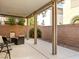 Covered patio with seating area, string lights, and a relaxing atmosphere at 3256 Umbria Gardens Ave, Las Vegas, NV 89141