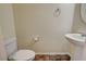 Simple bathroom with pedestal sink and tile floor at 4591 Woolcomber St, Las Vegas, NV 89115