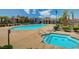 Community pool and spa with lounge chairs at 4591 Woolcomber St, Las Vegas, NV 89115