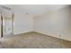 Spacious bedroom with carpet and access to another room at 4591 Woolcomber St, Las Vegas, NV 89115