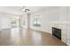 Living room with tile floors, fireplace and ceiling fan at 700 Carnegie St # 1512, Henderson, NV 89052