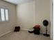 Small bedroom with pet bed and floor fan at 9622 Camino Capistrano Ln, Las Vegas, NV 89147