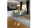 Bright dining room featuring a glass table and modern chairs at 9622 Camino Capistrano Ln, Las Vegas, NV 89147