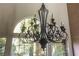 Elegant chandelier with a wrought iron design at 14 Pheasant Ridge Dr, Henderson, NV 89014