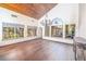 Bright dining room with hardwood floors, chandelier, and large windows at 14 Pheasant Ridge Dr, Henderson, NV 89014