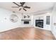 Gathering room with fireplace, built-in entertainment center and hardwood floors at 14 Pheasant Ridge Dr, Henderson, NV 89014