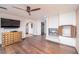 Living room with hardwood floors, fireplace and built in shelving at 14 Pheasant Ridge Dr, Henderson, NV 89014