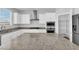 Modern kitchen with an island and white cabinets at 2696 Topaz Blue St, Las Vegas, NV 89146