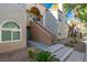 Condo building entryway with stairs and landscaping at 3145 E Flamingo Rd # 2018, Las Vegas, NV 89121