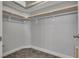 Large walk-in closet with double hanging rods at 1008 Domnus Ln # 103, Las Vegas, NV 89144