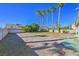 Large backyard with grassy area and palm trees at 4533 Bescano Dr, Las Vegas, NV 89122