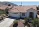 Single story home with tile roof and desert landscaping at 6529 Cordelle Dr, Las Vegas, NV 89156