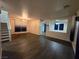 Bright living room with dark hardwood floors and a view into the dining area at 849 Purdy Lodge St, Las Vegas, NV 89138