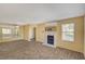 Living room with fireplace, wood-look floors, and mirrored wall at 9070 Spring Mountain Rd # 216, Las Vegas, NV 89117